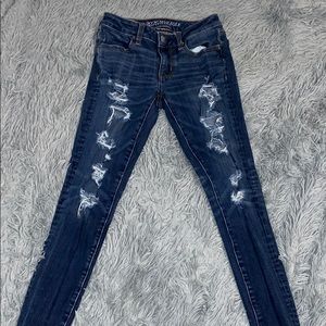 Dark washed ripped American eagle jeans